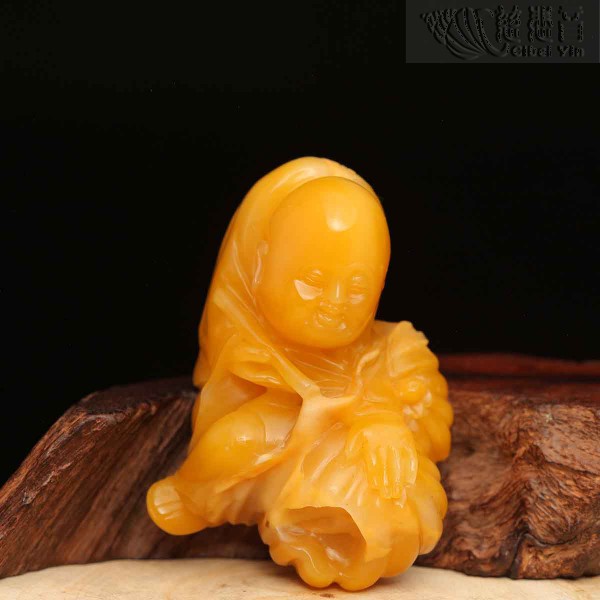 Shoushan stone carving of a golden child ornament