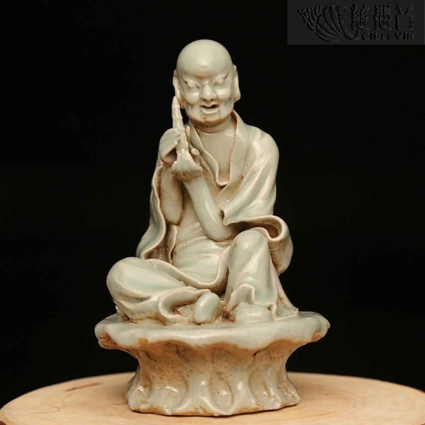 Celadon sculpture of  a holding tower lohan arhat