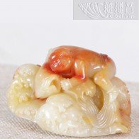 Shoushan stone carving of a child and fish ornament