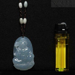 Mauve jadeite Guanyin with a lotus